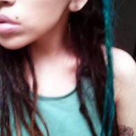 I look about 12 here but just showing you 2 dreads I dyed turquoise.