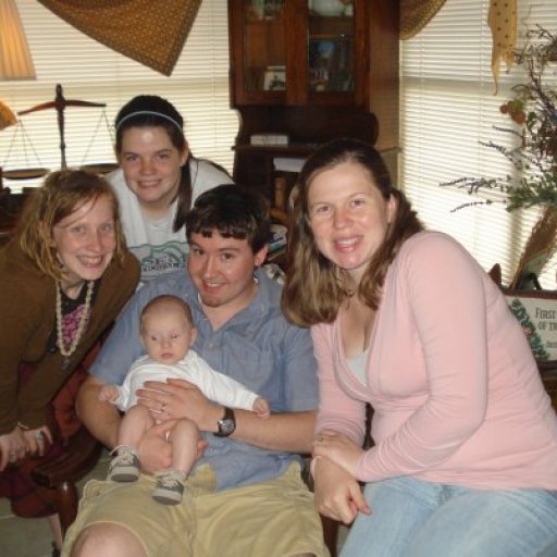 Me and my sisters, Shaunna and Denise, and her husband Johnathan. Baby Ryan's silly face in the middle.